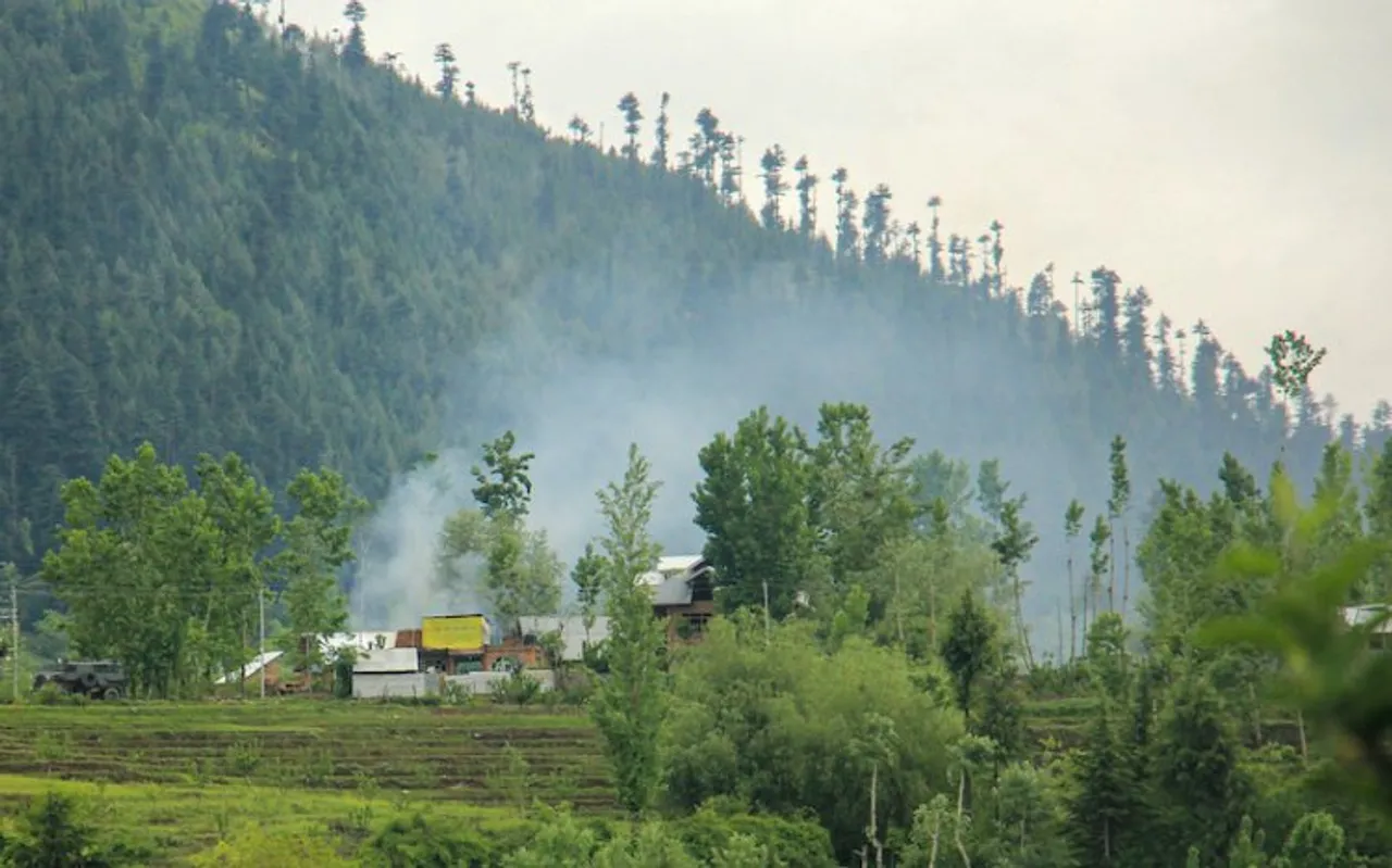 Smoke rises from a house during an encounter with terrorists in Jammu