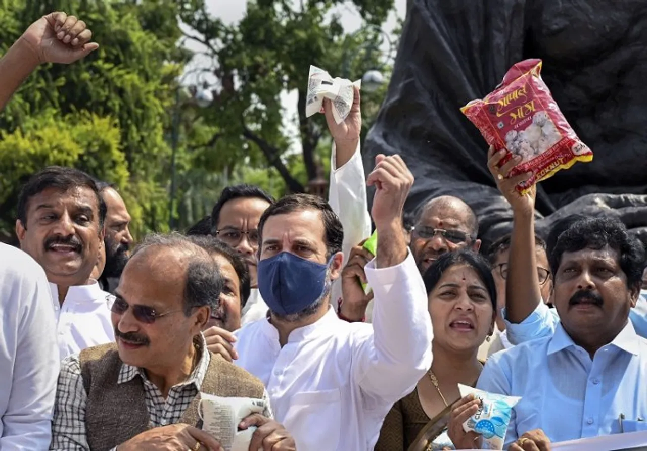 Congress MP Rahul Gandhi with Mallikarjun Kharge, Adhir Ranjan Chowdhury and other opposition MPs during a protest against inflation and the decision to increase GST on food items, at Parliament complex, in New Delhi