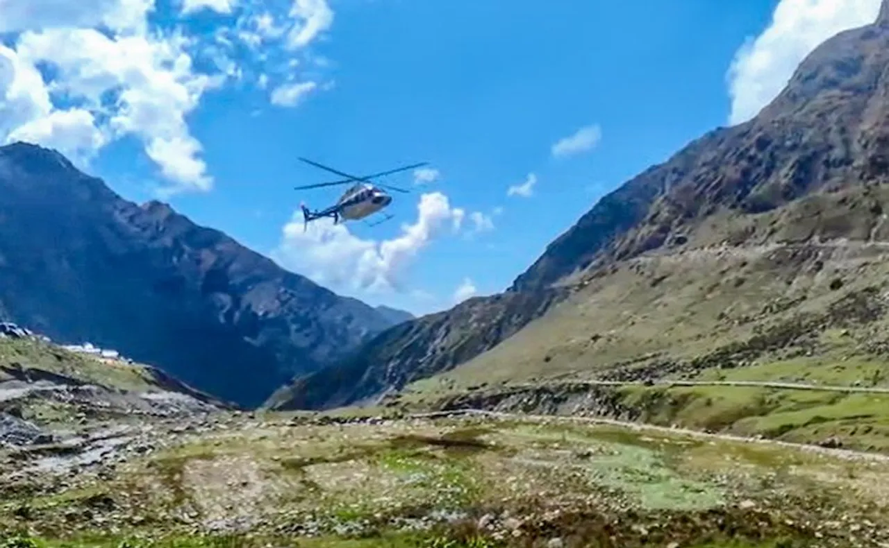 Videograb of a chopper carrying pilgrims to Kedarnath