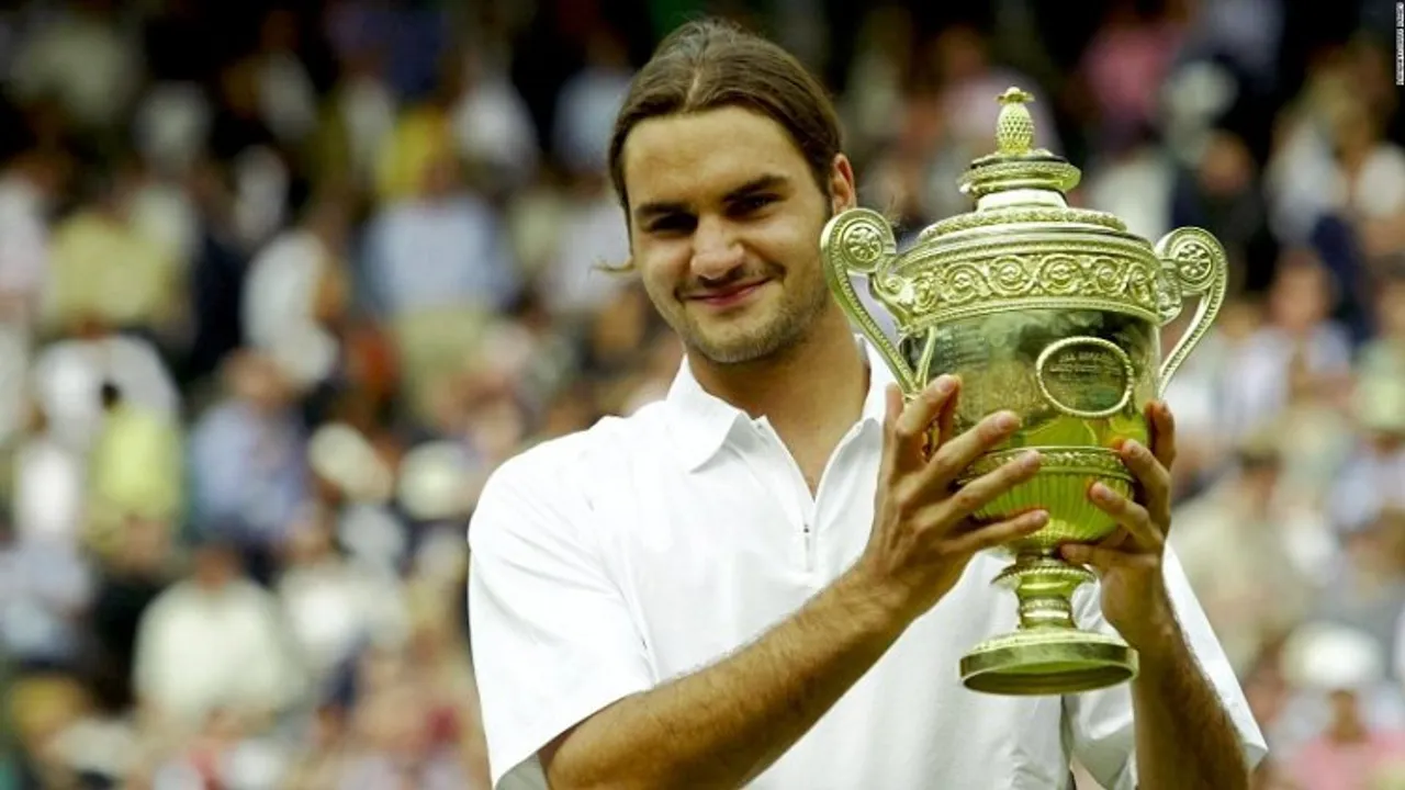 Roger Federer with his first major grand slam title - Wimbledon 2003 (File photo)