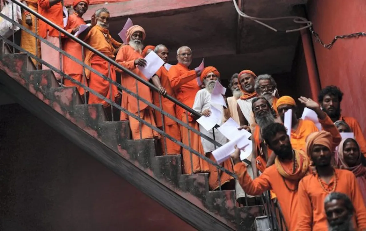 Sadhus wait to get themselves registered for the Amarnath Yatra 2022, at Ram Mandir base camp, in Jammu