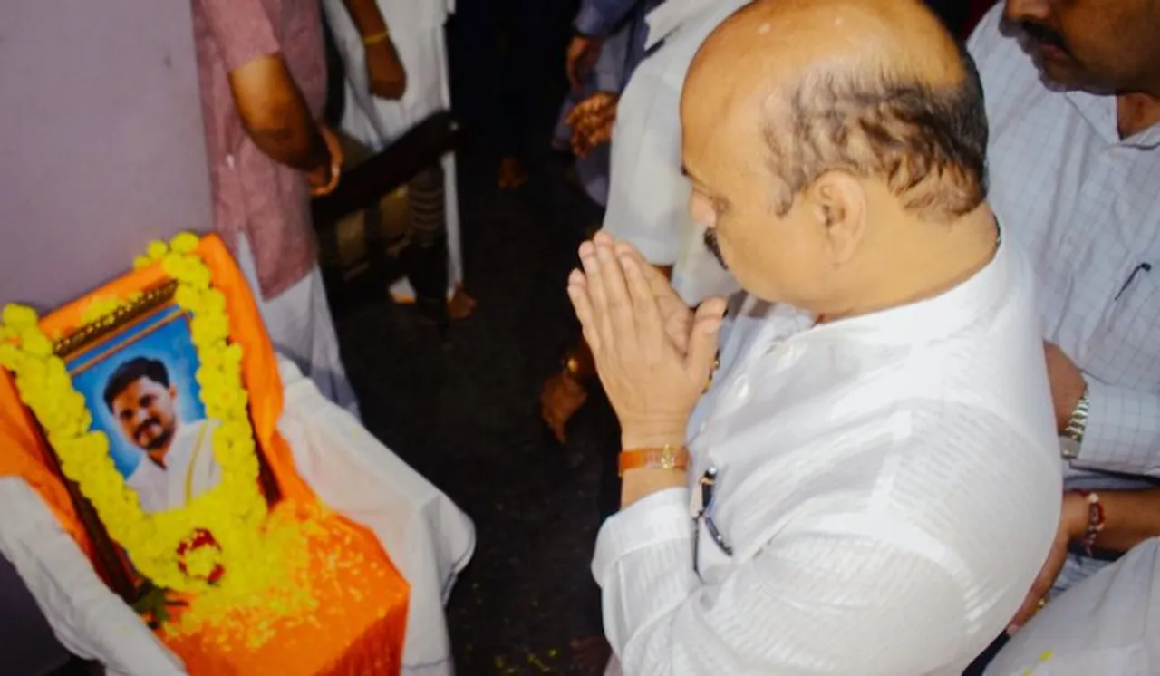 Karnataka Chief Minister Basavaraj Somappa Bommai pays tribute to BJP worker Praveen Nettaru, who was murdered by unidentified people, at his residence in Mangaluru