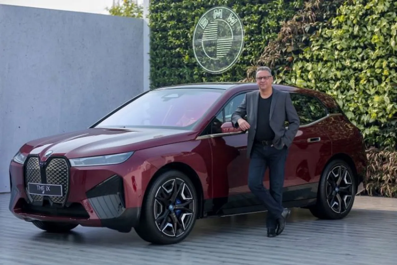 Mr. Vikram Pawah, President, BMW Group India with the BMW iX 