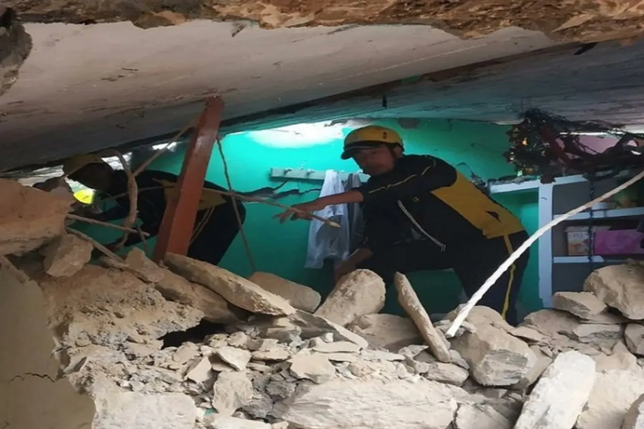House under debris from landslide