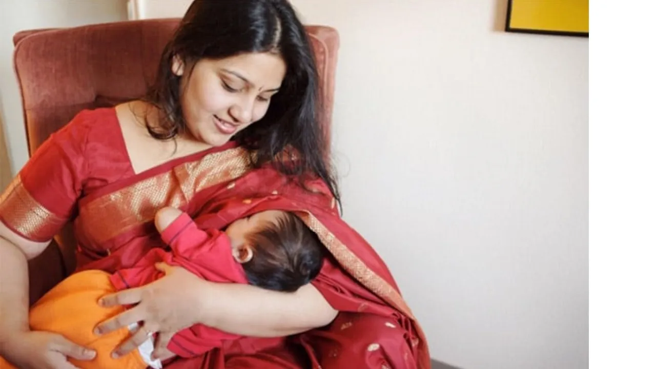 indian mother breast feeding to baby