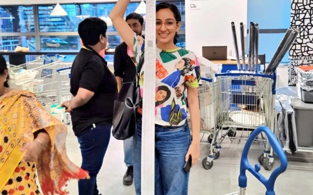 Woman’s shopping bill at IKEA taller than her