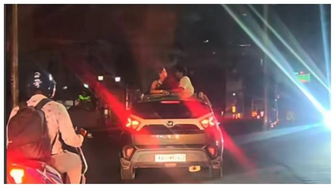 Bangalore: Youth’s romantic stunt on Trinity Road from car sunroof draws attention