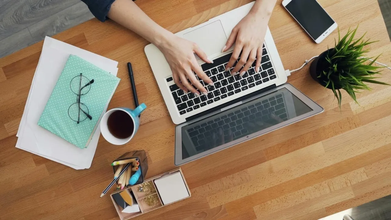 Person using smartphone for online personal loan application amid financial literacy icons