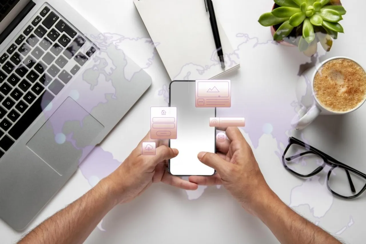 Indian driver checking a car insurance app on a smartphone beside a car on a scenic road.