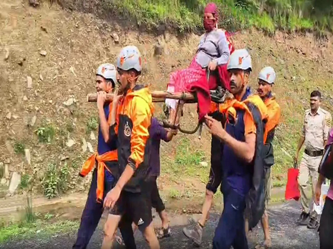 SDRF evacuates pregnant woman from flood-hit Janjehli region. (Photo/ANI)