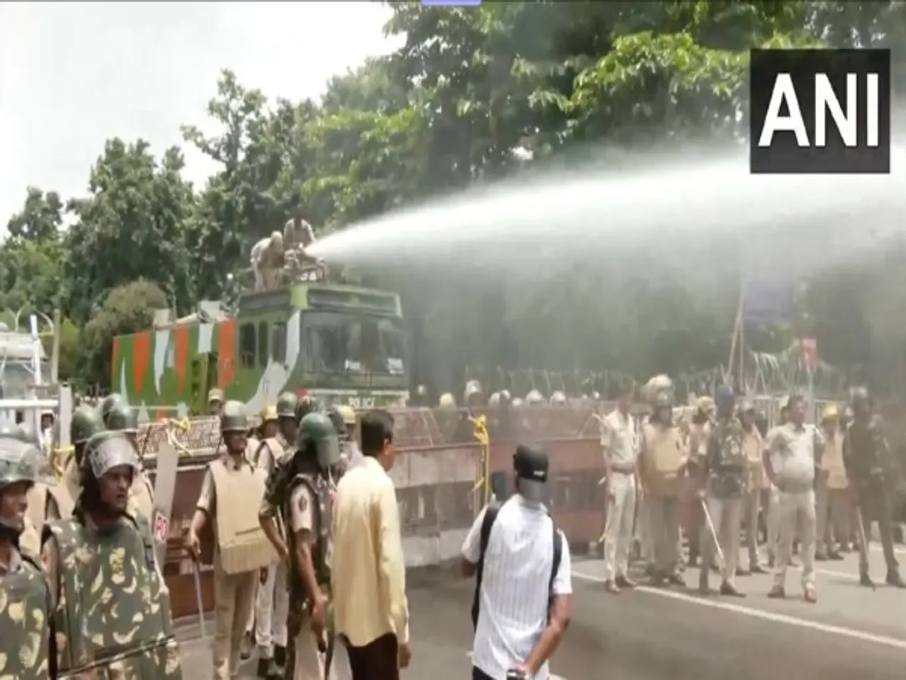 Police use water cannon to disperse BJD workers protesting over Balasore student's death by self-immolation. (Photo/ANI)
