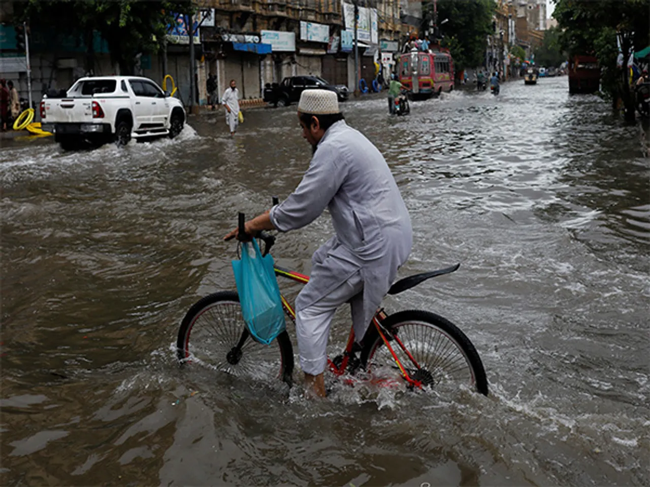 Residents navigate flooded streets as heavy monsoon rains lash Punjab, Pakistan (File Photo/Reuters)