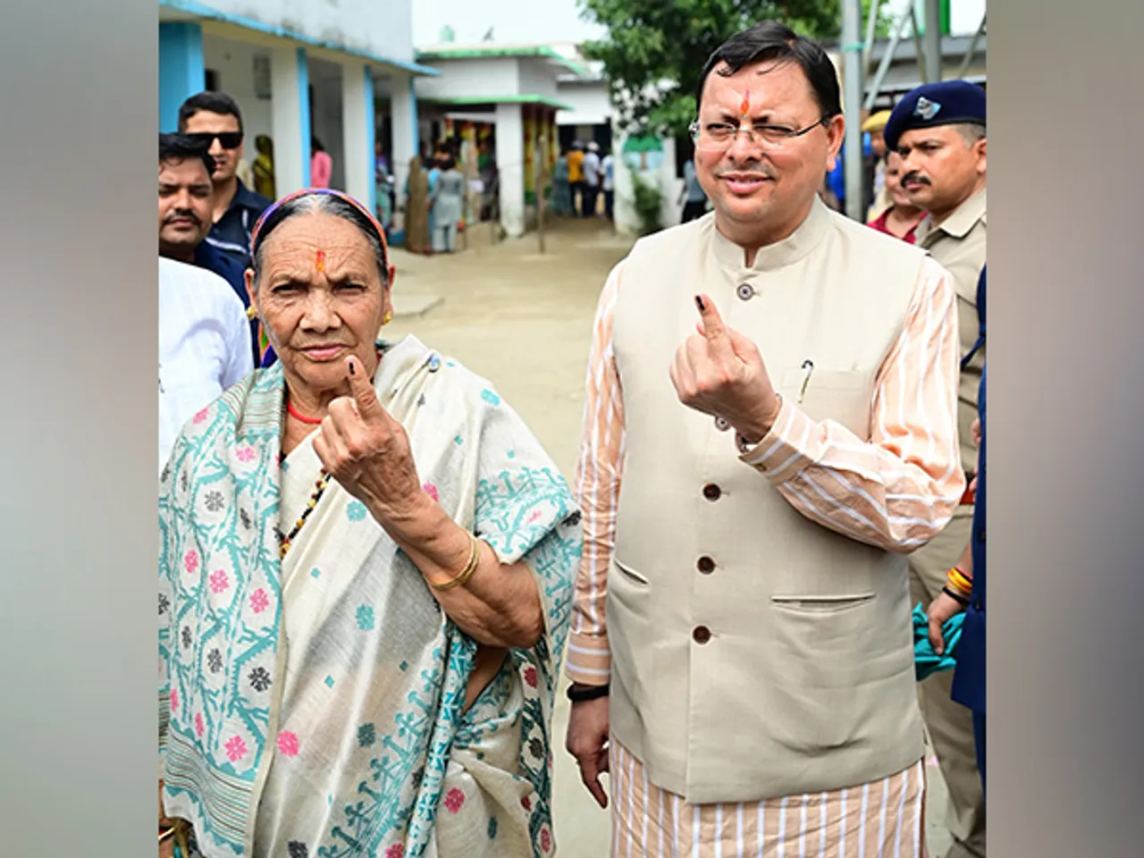 CM Pushkar Singh Dhami and mother Bishna Devi caste vote for three-tier Panchayat elections (Photo/ANI)