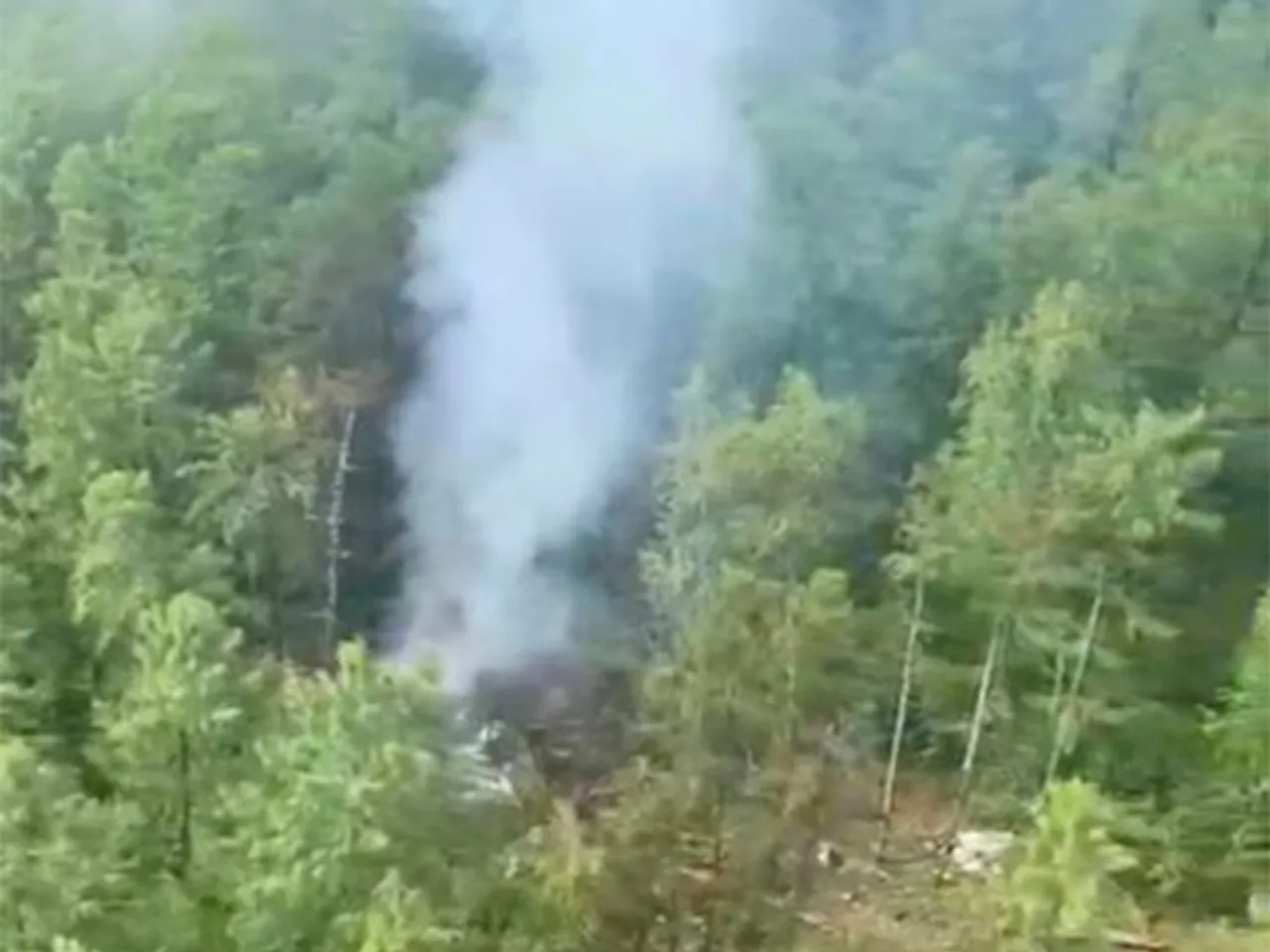 Smoke rises at the crash site of an Angara Airlines An-24 passenger plane near Tynda in the Amur Region (Image/Reuters)