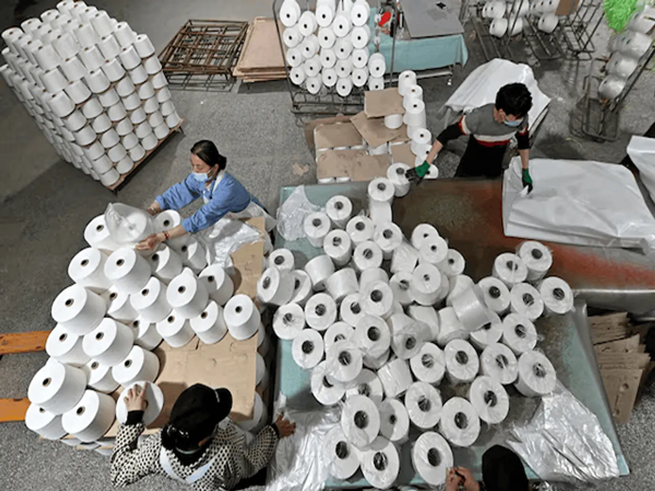 Image Source: Workers are seen on the production line at a cotton textile factory in Korla, Xinjiang Uighur Autonomous Region, (Photo/Reuters)