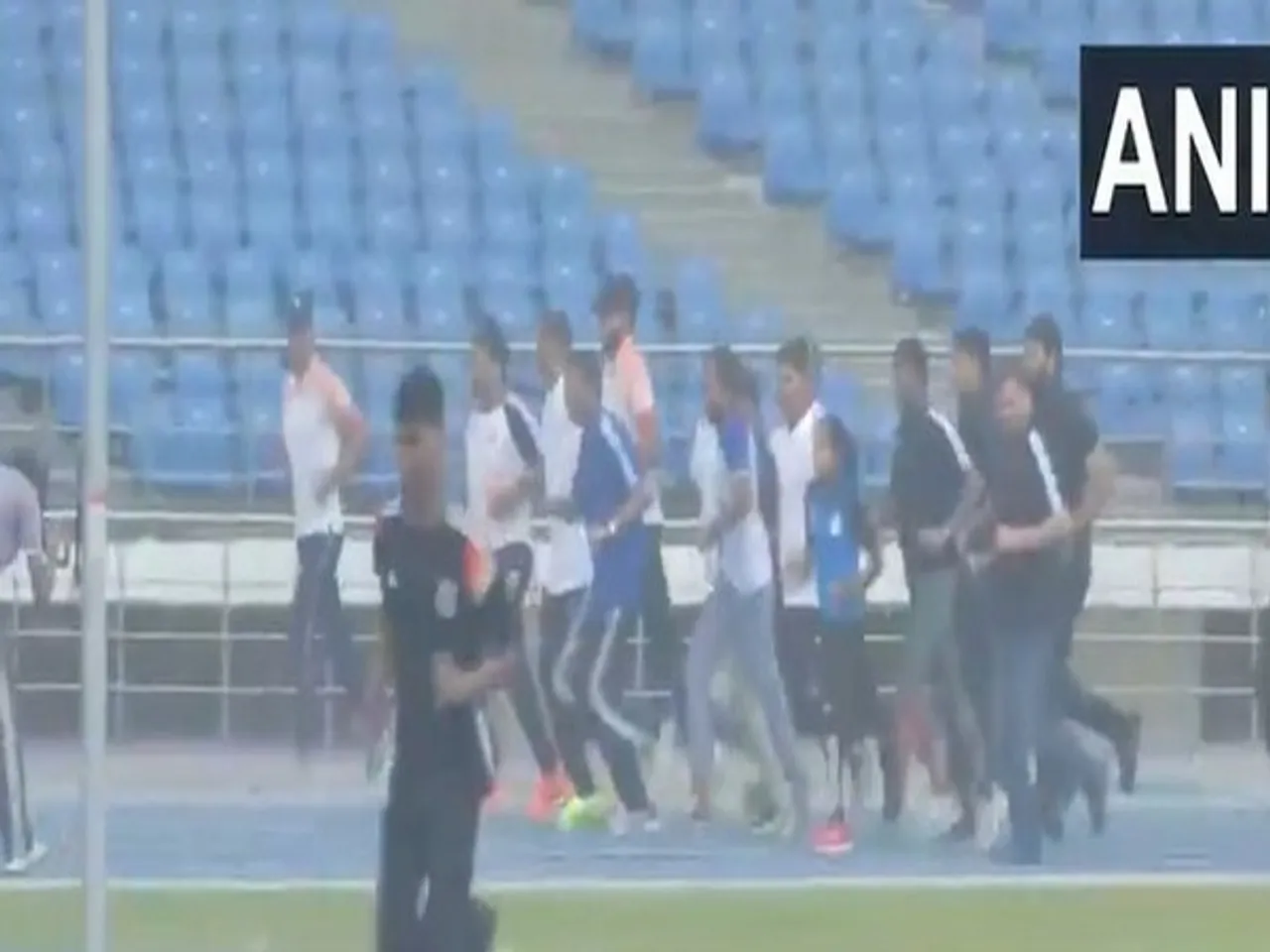 Union Sports Minister Mansukh Mandaviya running with Indian athletes at the track (Photo: ANI)