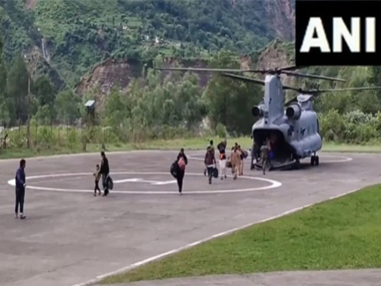 Pilgrims coming down from Air Force's Chinook helicopter in Himachal's Chamba (Photo/ANI)