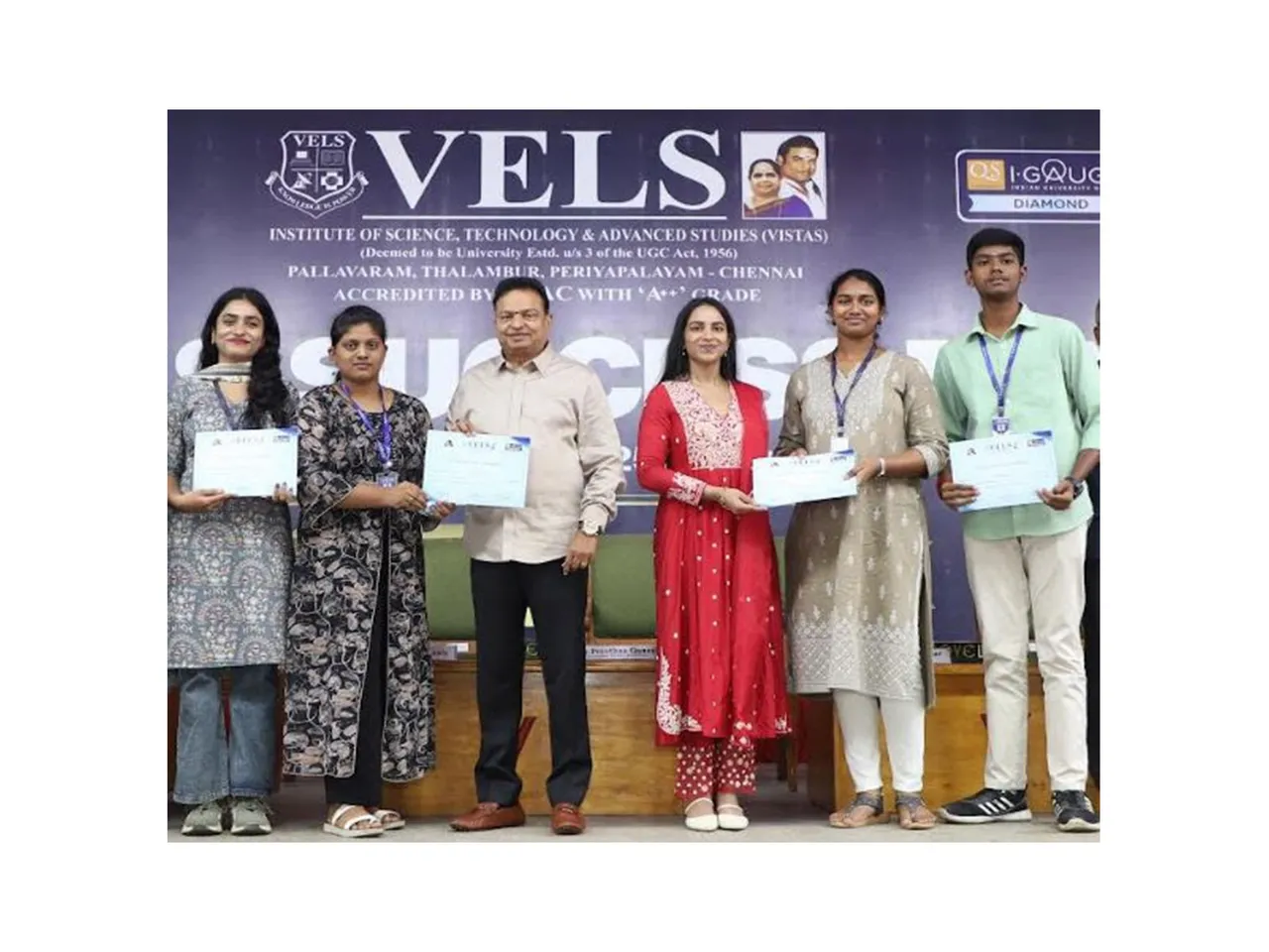 Students receiving scholarship certificates from Dr. Ishari K. Ganesh, Founder–Chancellor, and Dr. Preethaa Ganesh, Vice President, VELS Group of Institutions, during Vels Success Day 2024–25