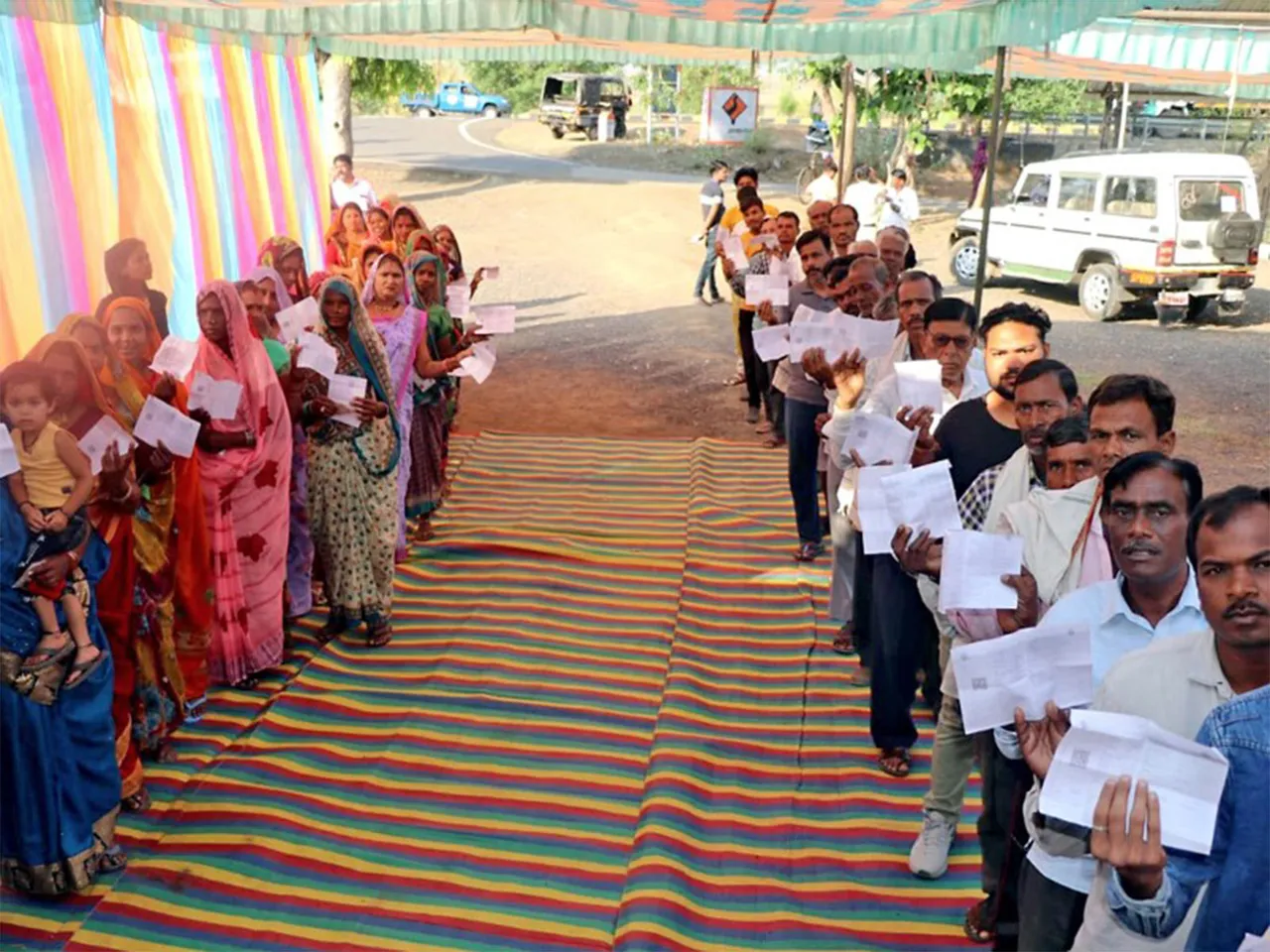 Male and Female voters standing in queues to cast their votes (File Photo/ANI)