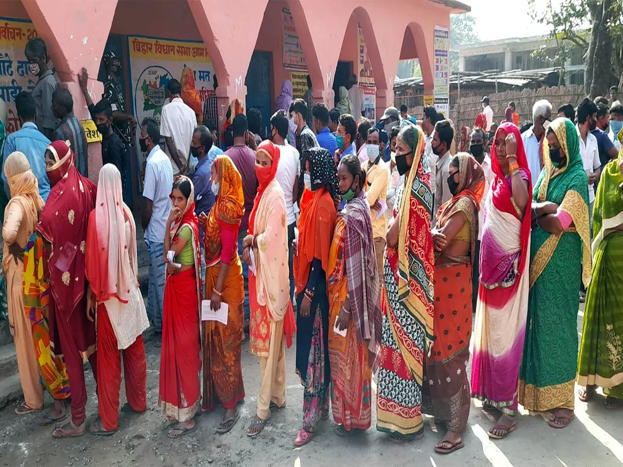 Voters stand in queues at the polling station to cast votes. (File Photo/ANI)