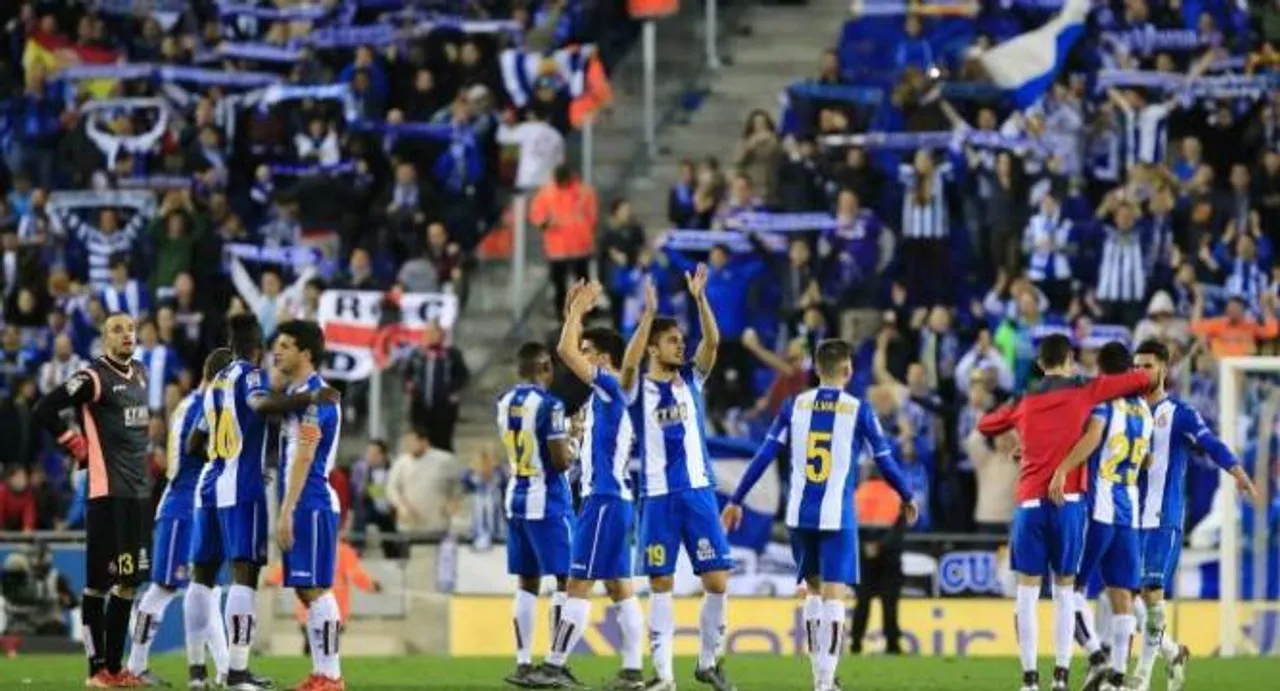 Espanyol put brakes on Barca, Atletico go top