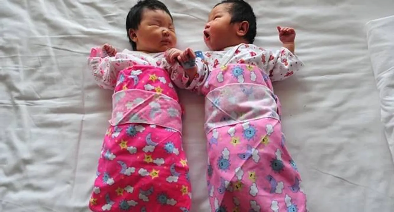 China scraps approvals for first, second child