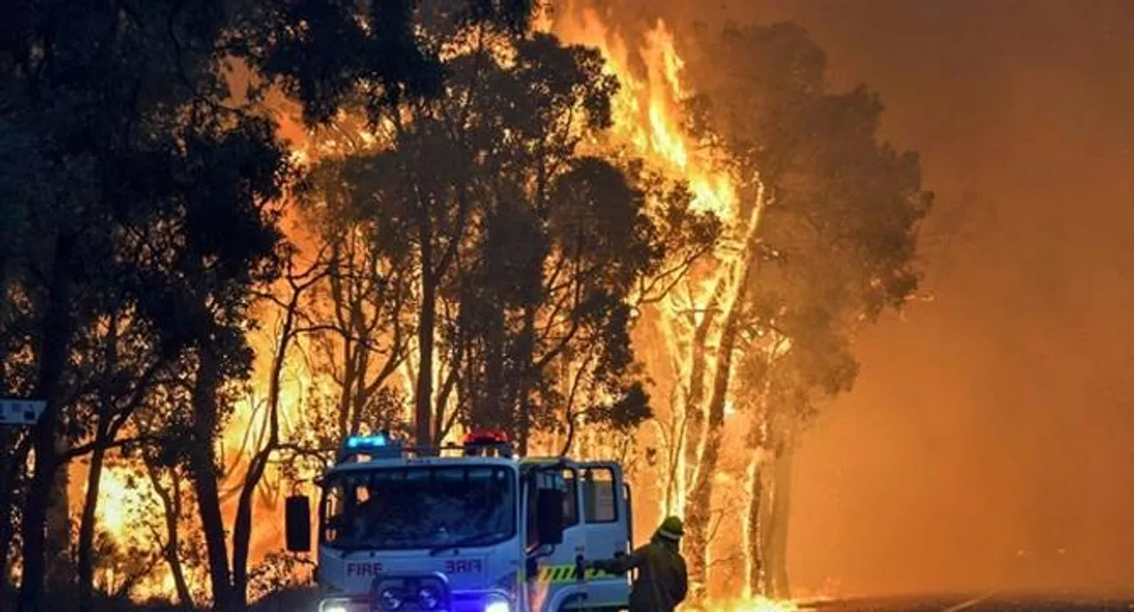 Two dead as firefighters battle huge Australia bushfire