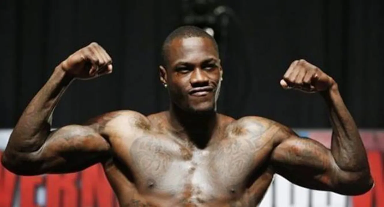 Wilder wins by KO, trades tough talk with Fury