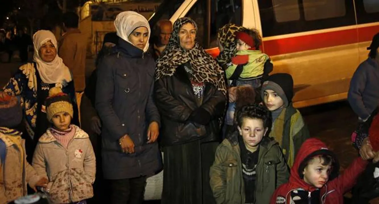 In besieged Syrian city, hungry residents sell gold for food