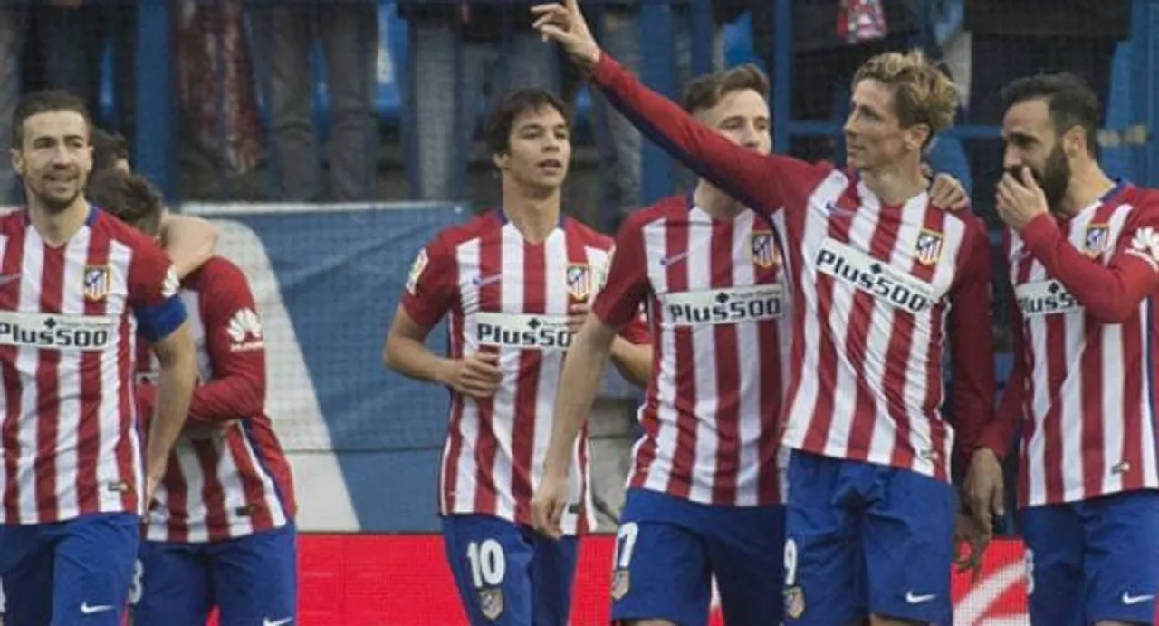 Torres reaches century, Atletico keep pressure on Barca