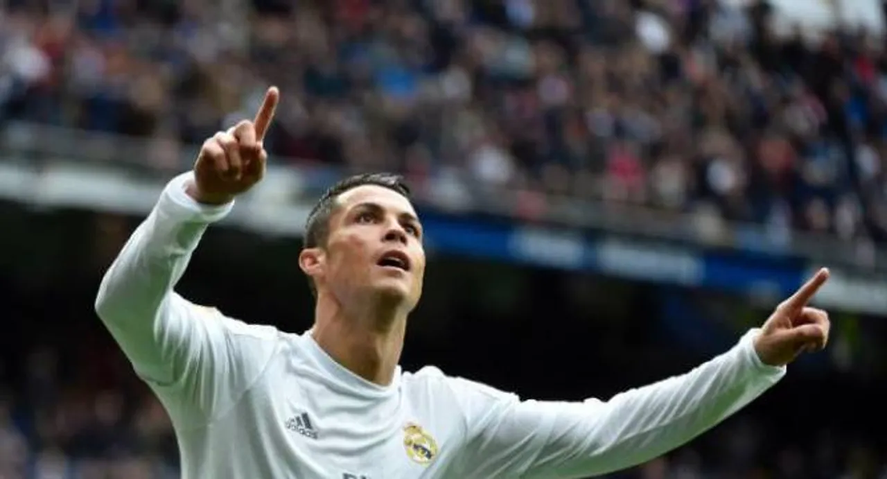 Ronaldo hits double in Madrid win, Neville records first win