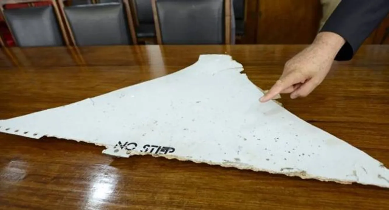 Suspected MH370 debris handed to Malaysian experts