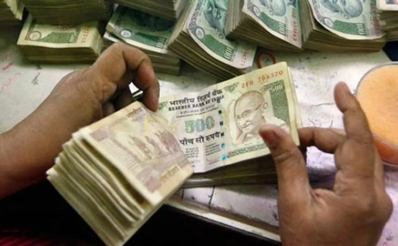 Rupee gains 6 paise against dollar