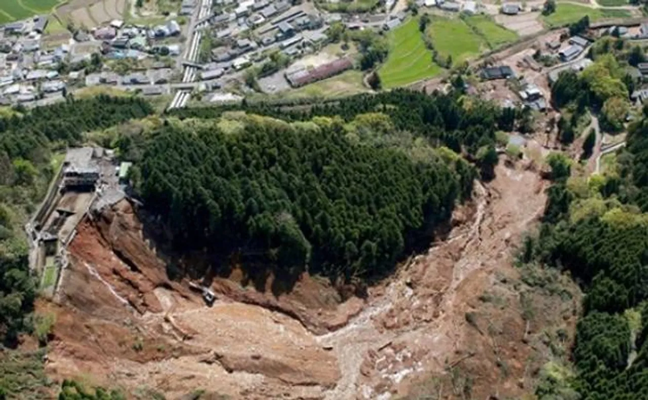 Rescuers race against landslides to reach Japan quake victims