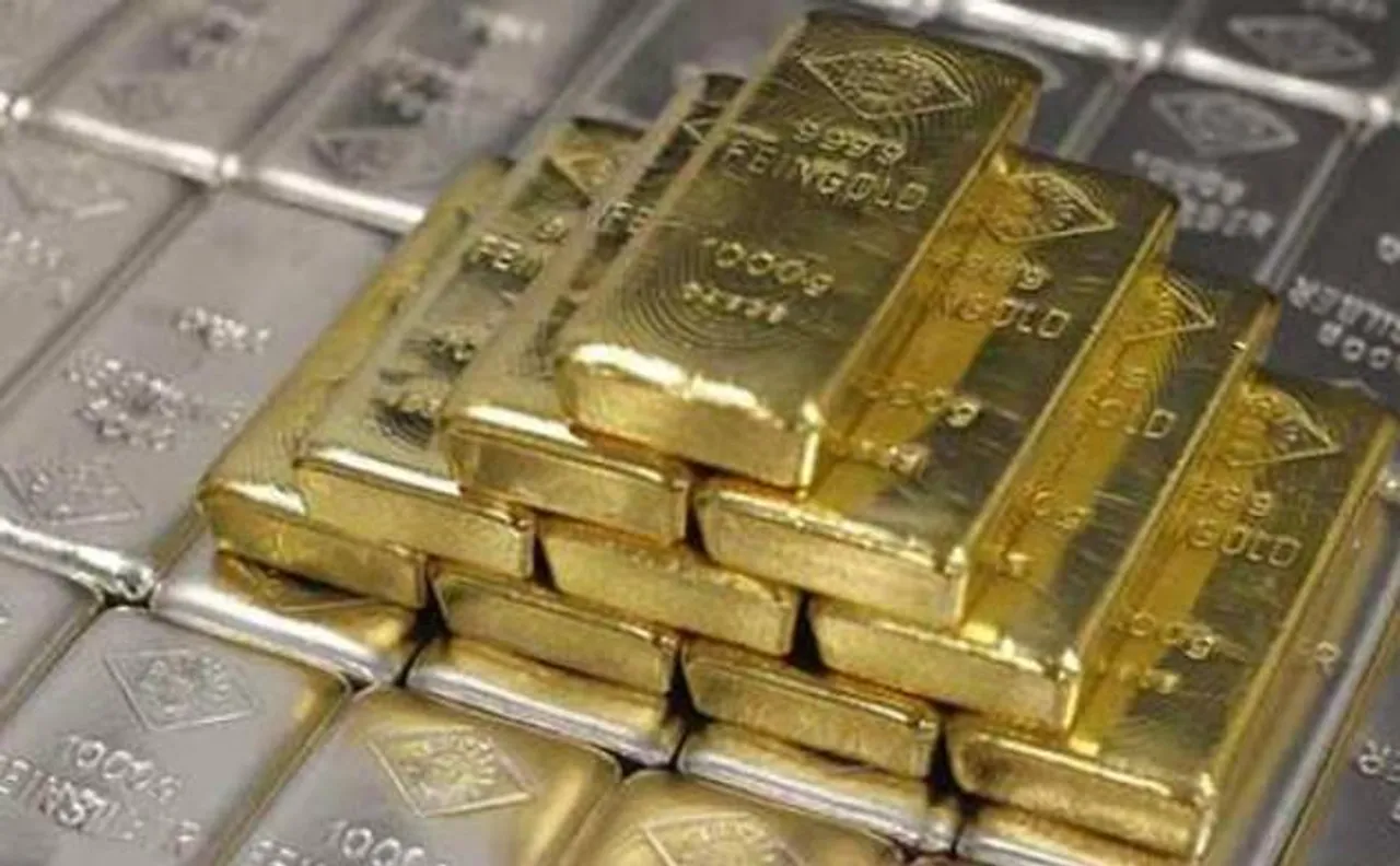 Gold slips on low demand, silver rebounds sharply