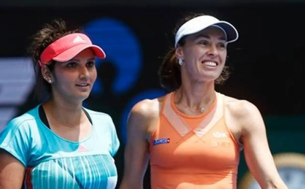 Sania, Martina labour into second round of French Open