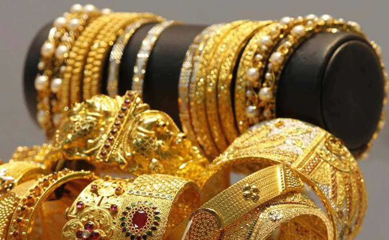 Gold takes gain forward, up Rs 232 on global cues