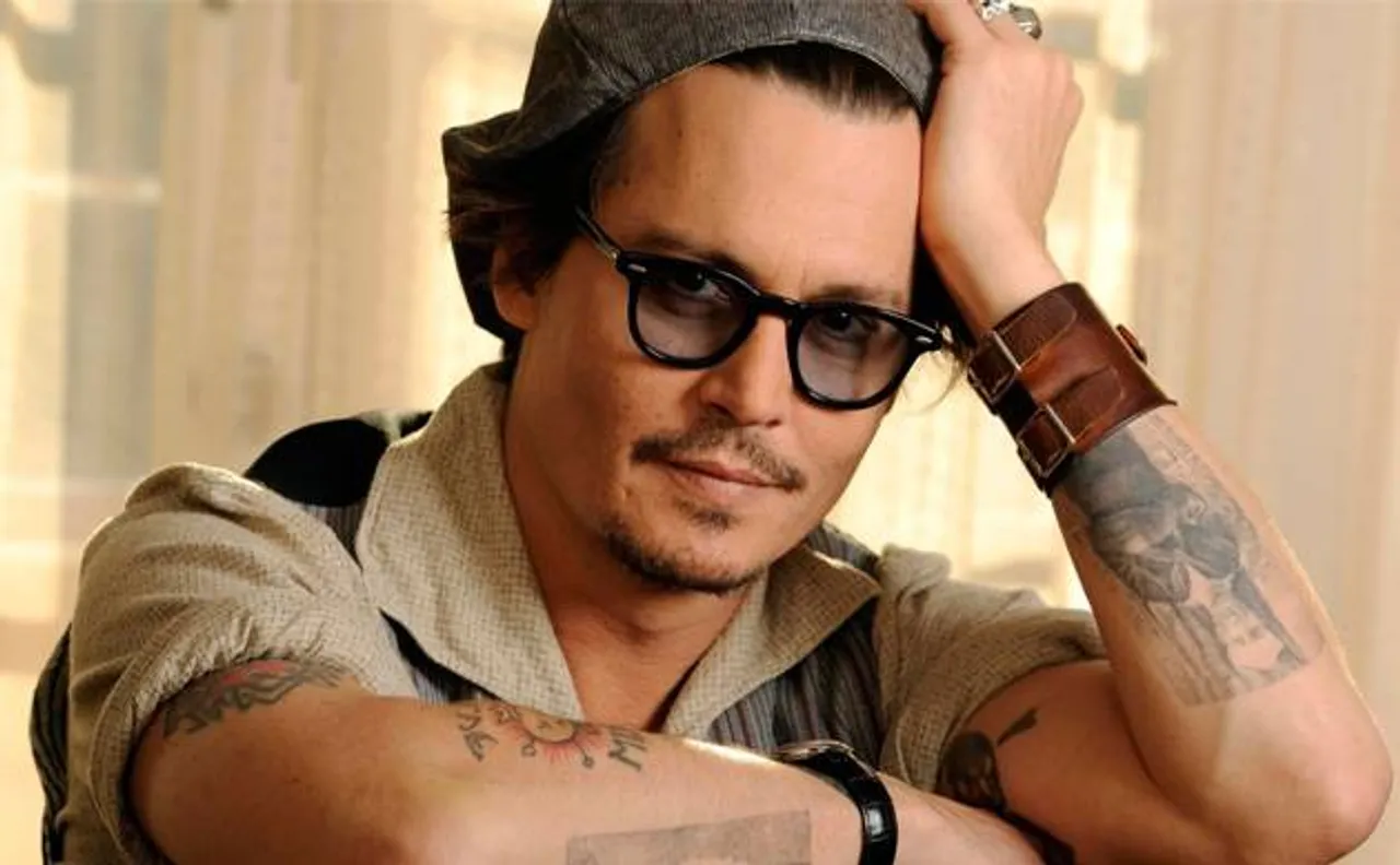 Johnny Depp alters Amber Heard 'slim' tattoo to 'scum'