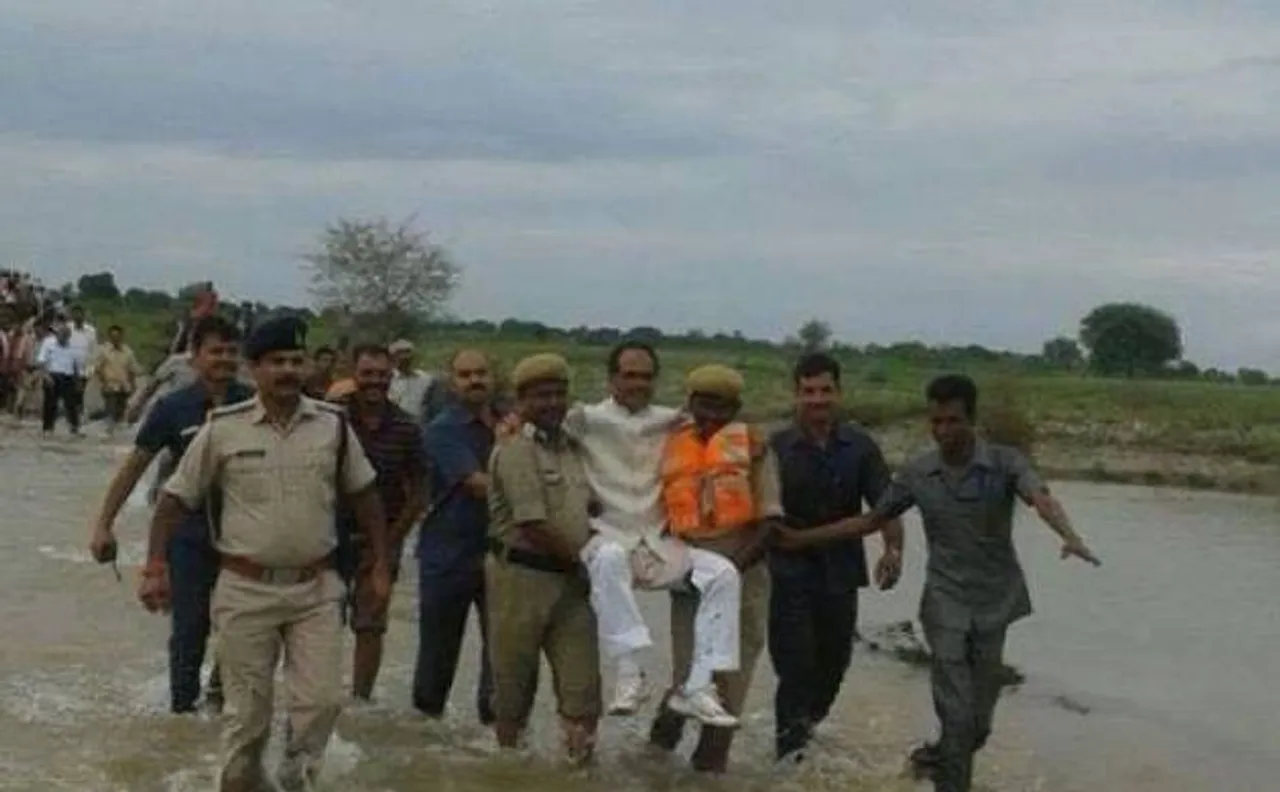 Shivraj Singh Chouhan carried by security men in flood hit area, mocked on twitter