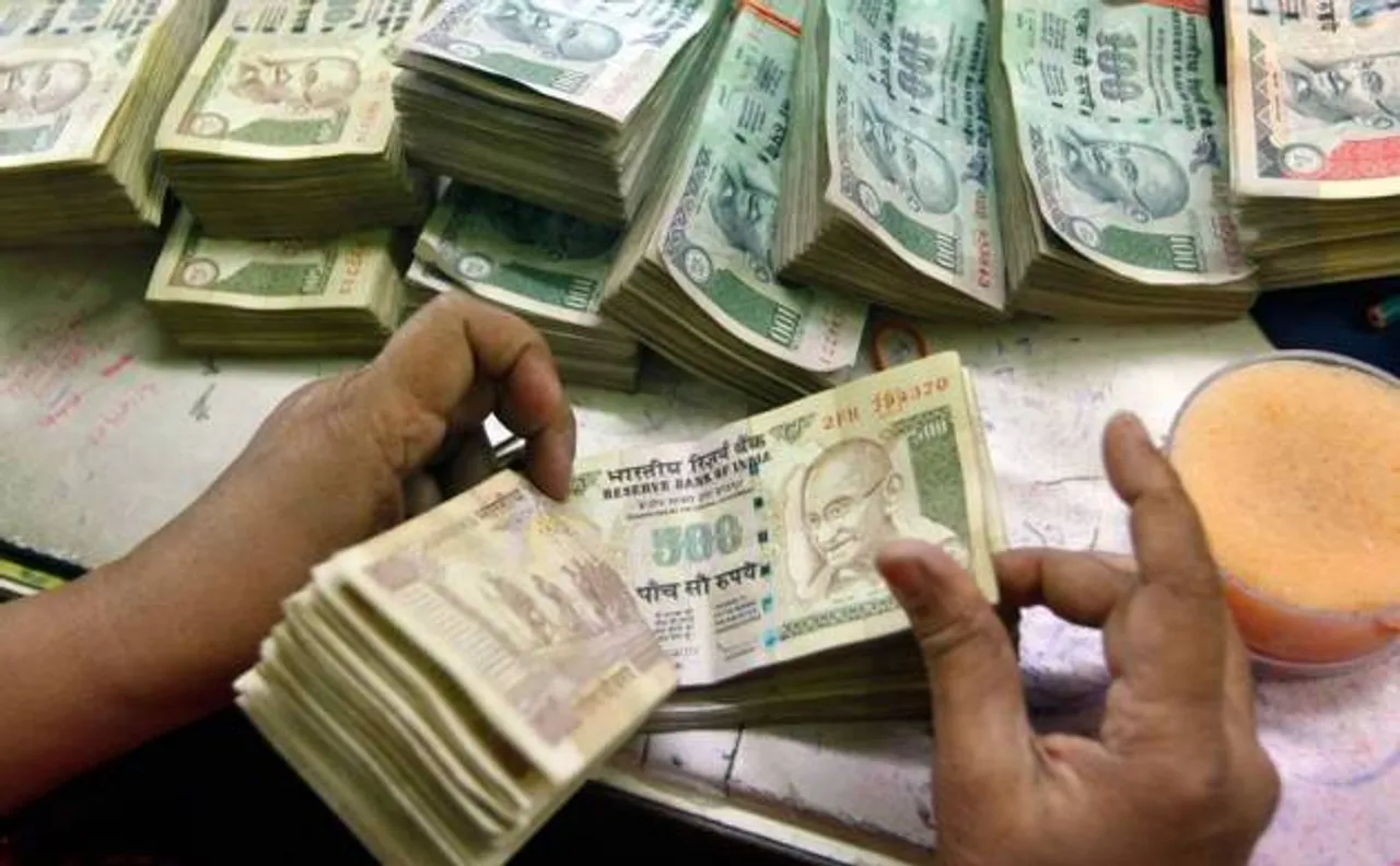 Rupee softens by 12 paise to 66.49 against the US dollar