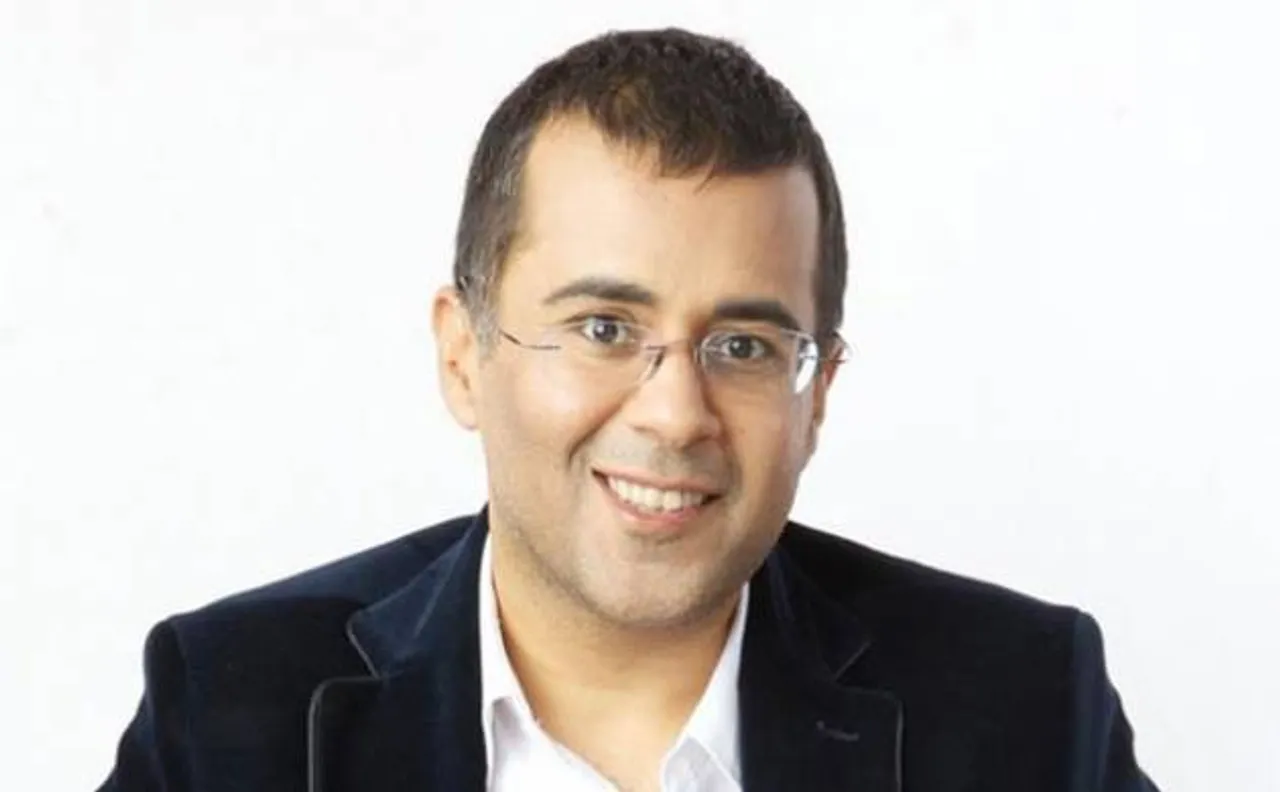 Chetan Bhagat slams Manish Sisodia on Twitter, questions 'his' Finland tour