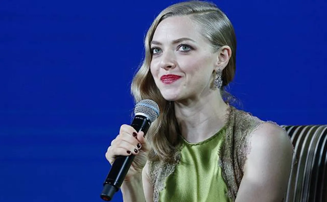 Pregnant Amanda Seyfried flaunts her baby bump in sheer mini dress