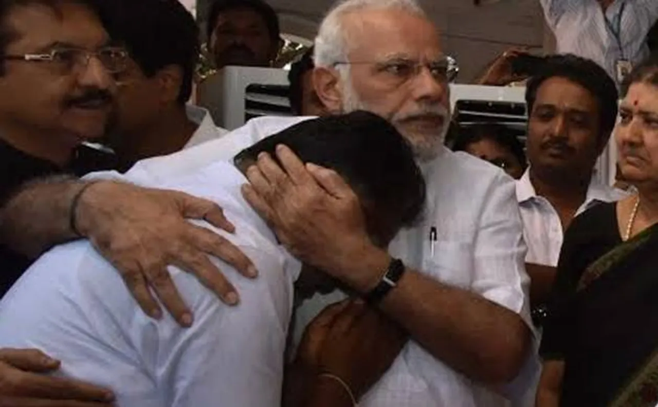 PM Narendra Modi hugs teary-eyed Panneerselvam after paying tributes to Jayalalithaa