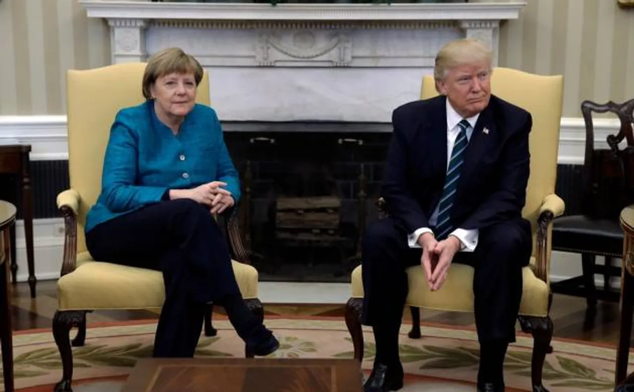 Donald Trump holds maiden talks with Angela Merkel, denies handshake, says he is not an isolationist
