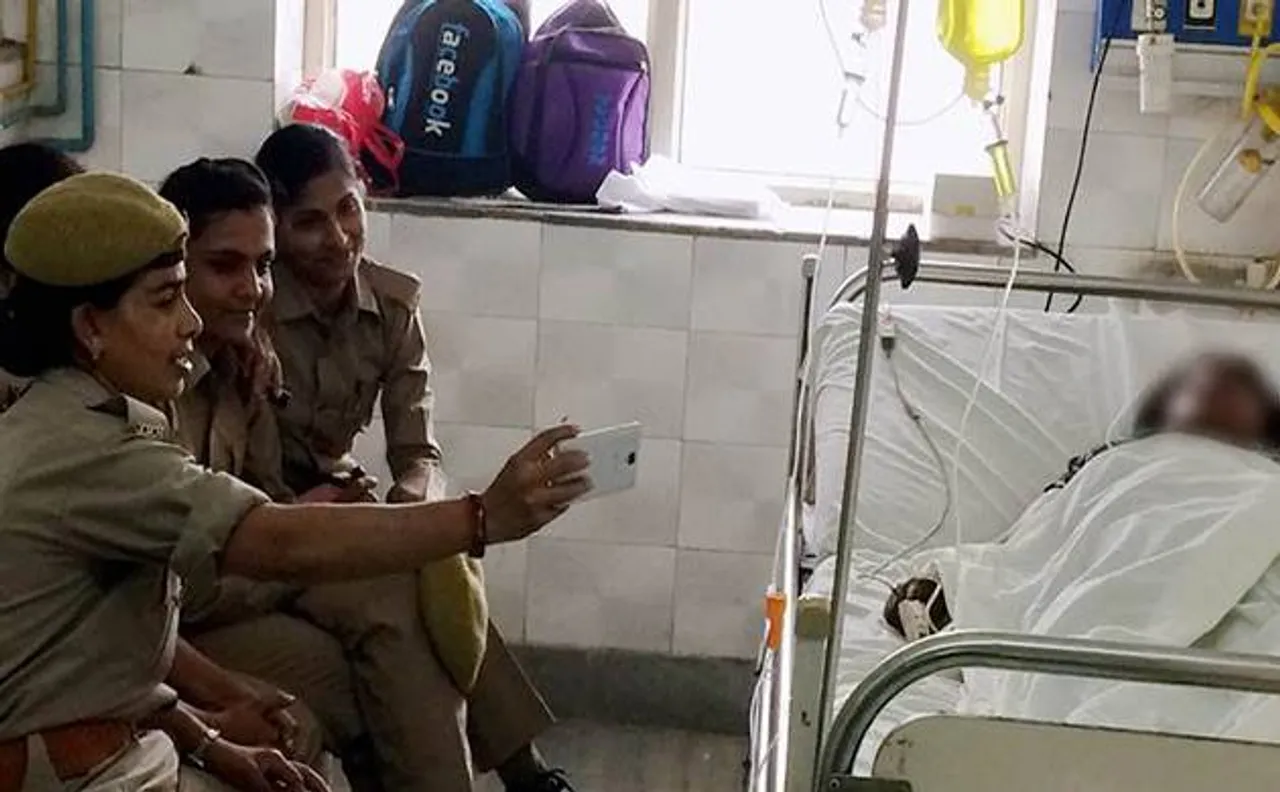 UP Police suspends women cops for taking selfies with acid attack victim