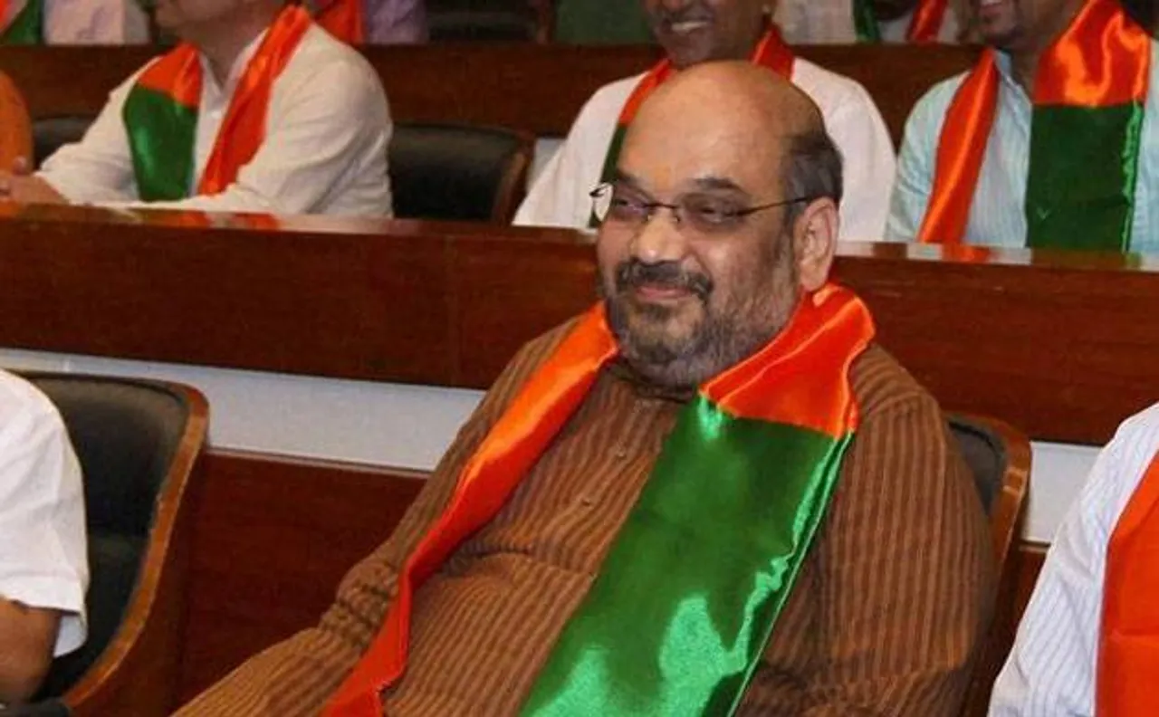BJP president Amit Shah gets enthusiastic welcome from partymen; offered two lotus garlands