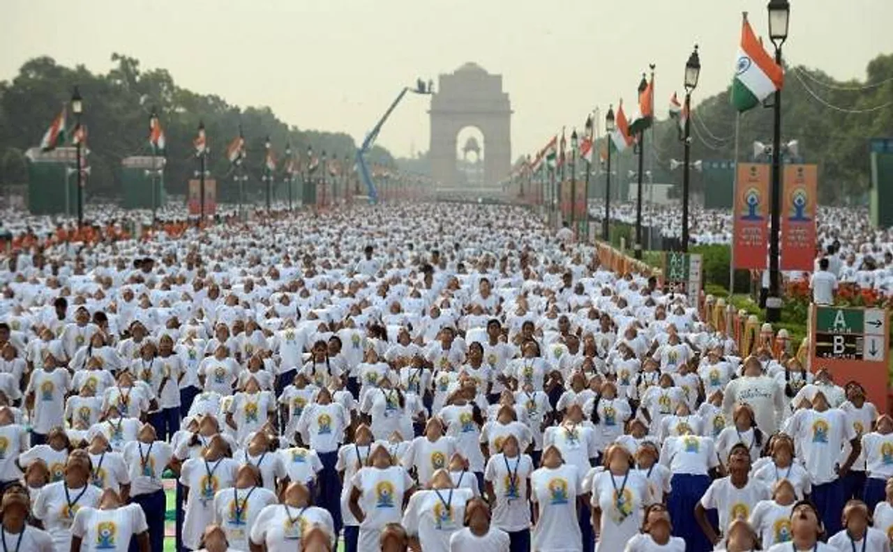 International Yoga Day: Delhiites fight rains to perform asanas