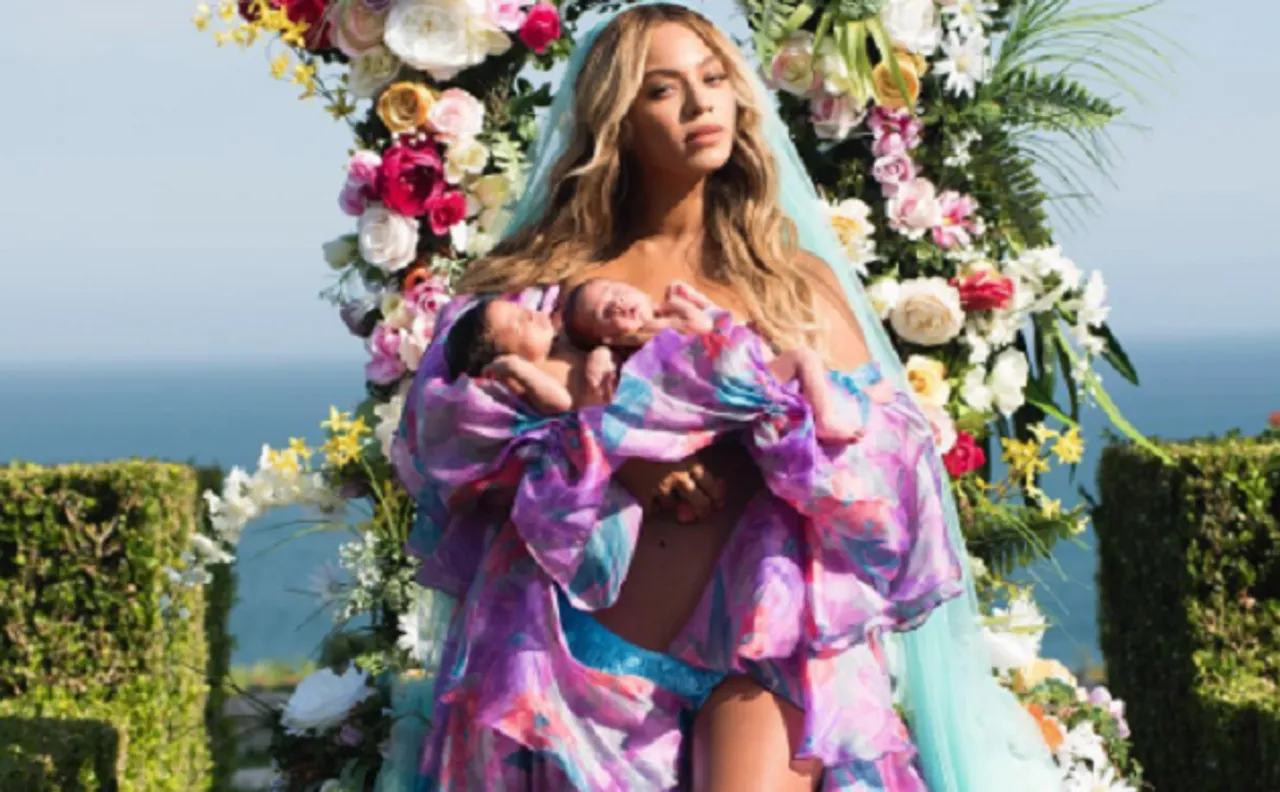 Beyonce looks like a fairy in this picture with her twins