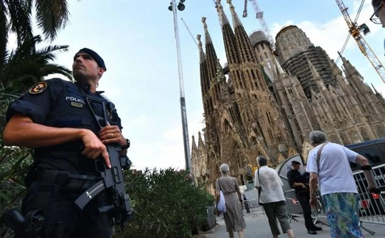 Police uncover arsenal of 120 gas canisters as Barcelona mourns