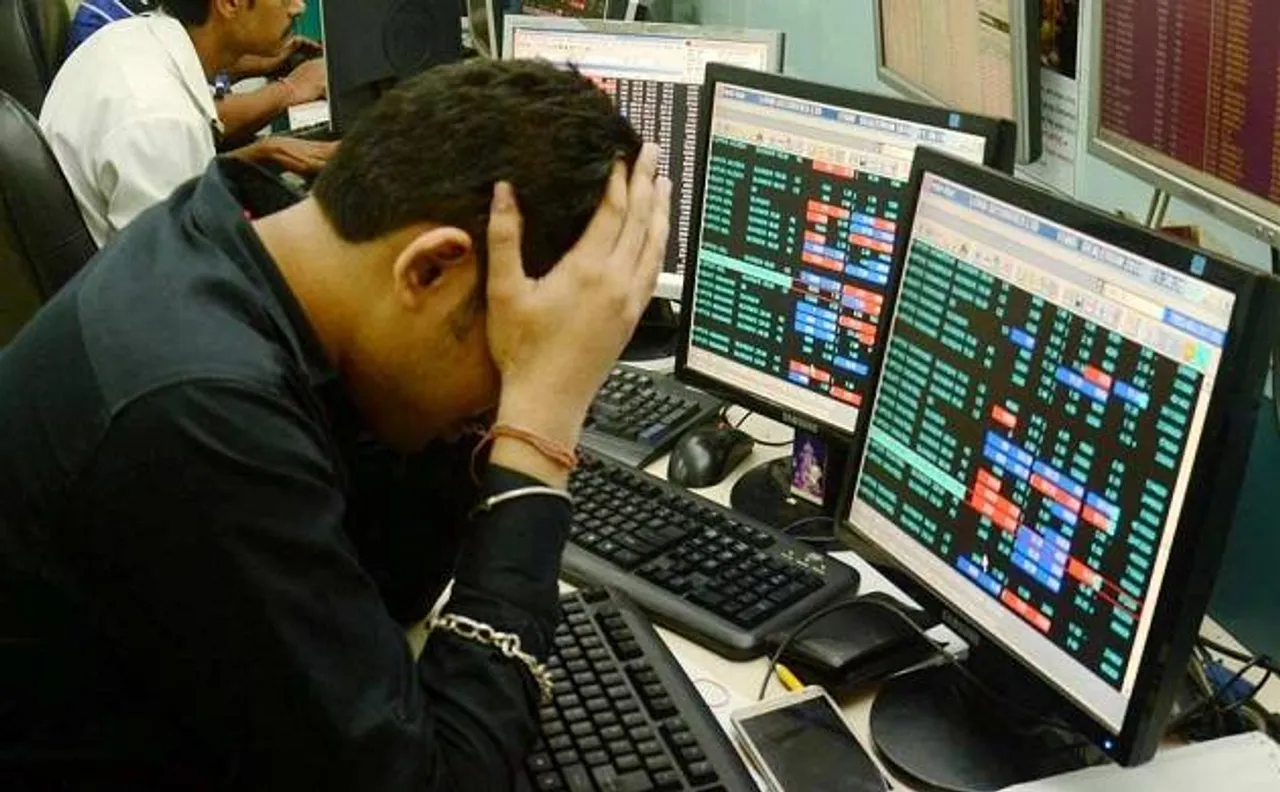 Sensex retreats from record high, falls 244 points, Gold begins 2018 on flat note